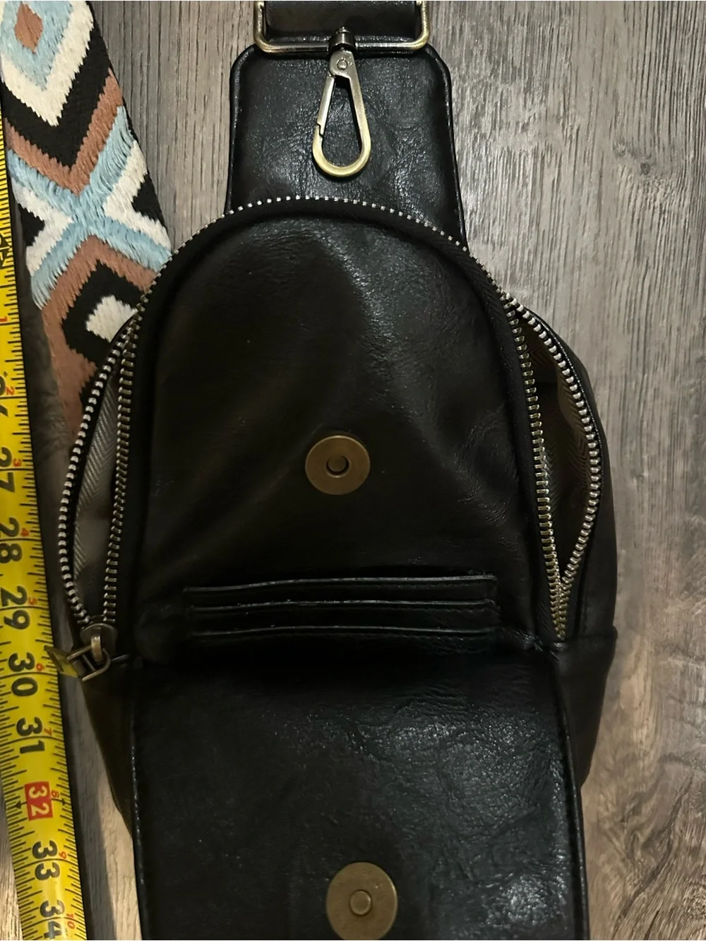 Black Leather Crossbody Sling Bag with Patterned Strap